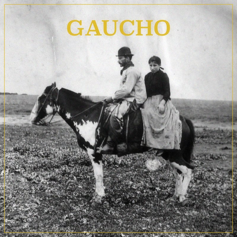Gaucho cover: an old photograph of a gaucho and a woman on a piebald horse on the pampa